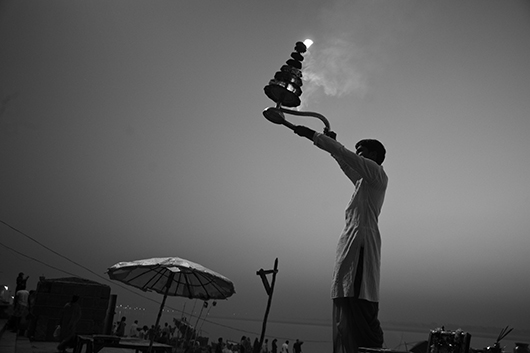 priest performing puja ganga ghat varanasi uttar pradesh India Asia