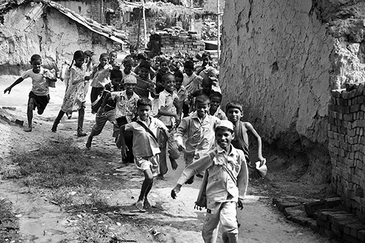 school children running varanasi uttar pradesh India Asia